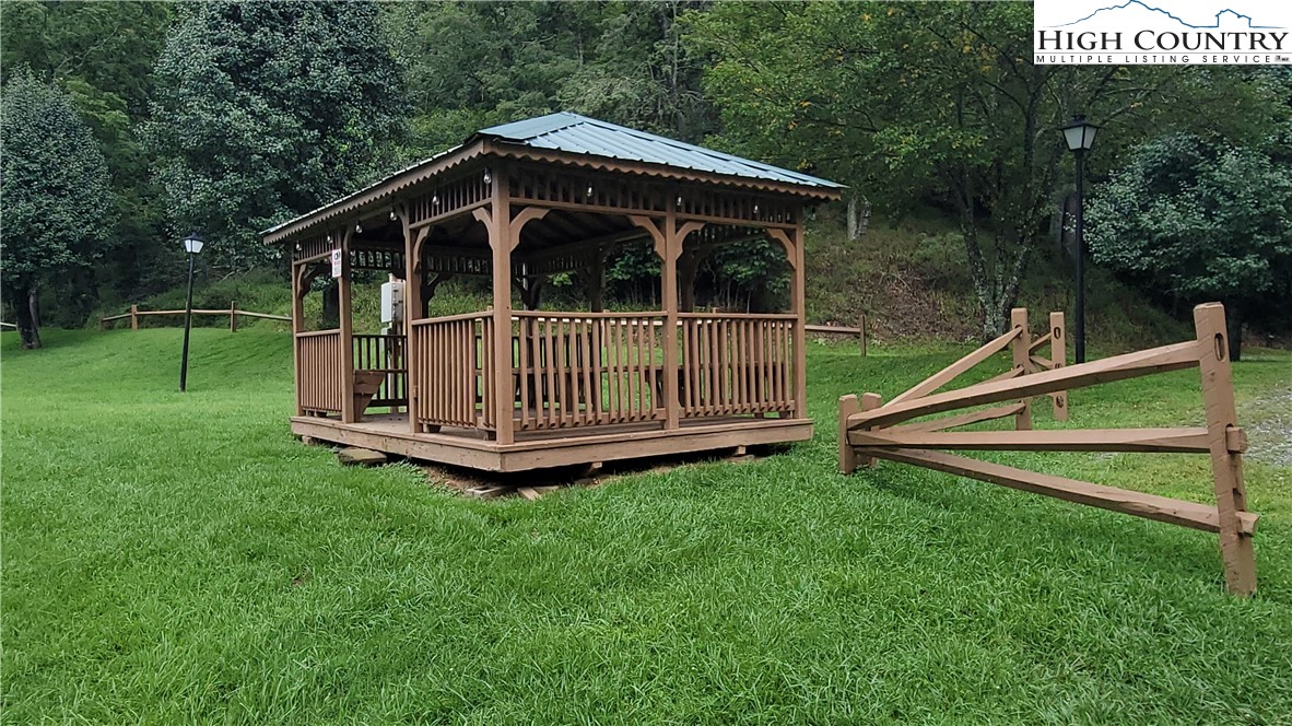 637 River Country Road Piney Creek, NC 28663 - Photo 41 of 49 a view of backyard with small cabin