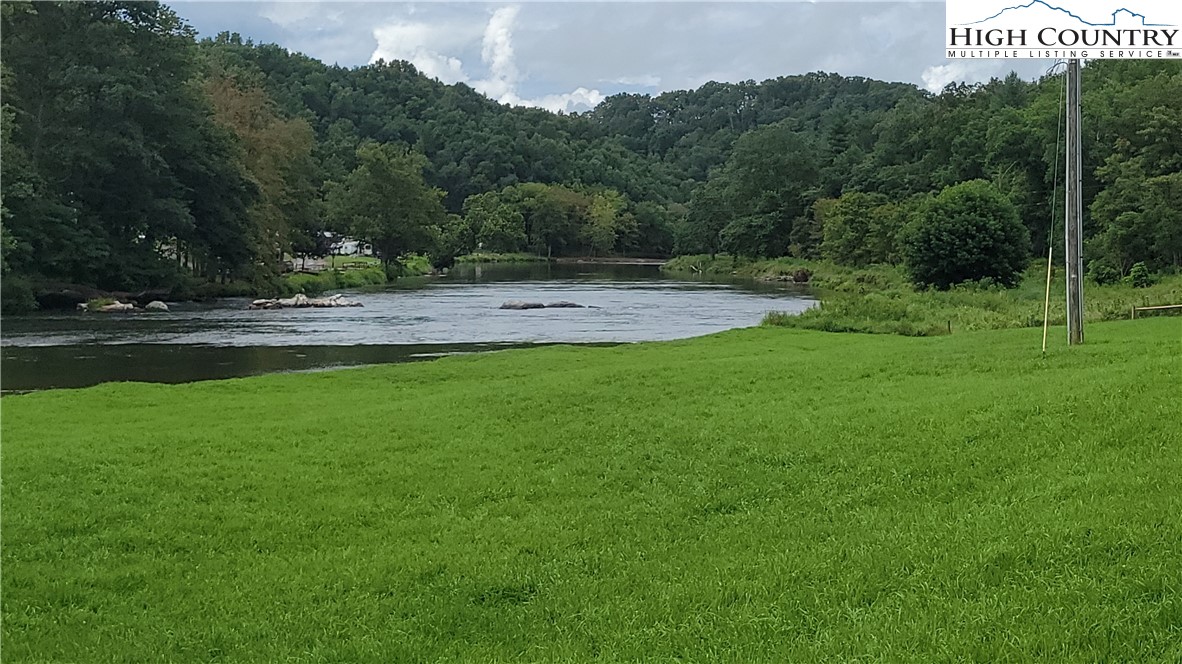 637 River Country Road Piney Creek, NC 28663 - Photo 44 of 49 a view of a park with large trees