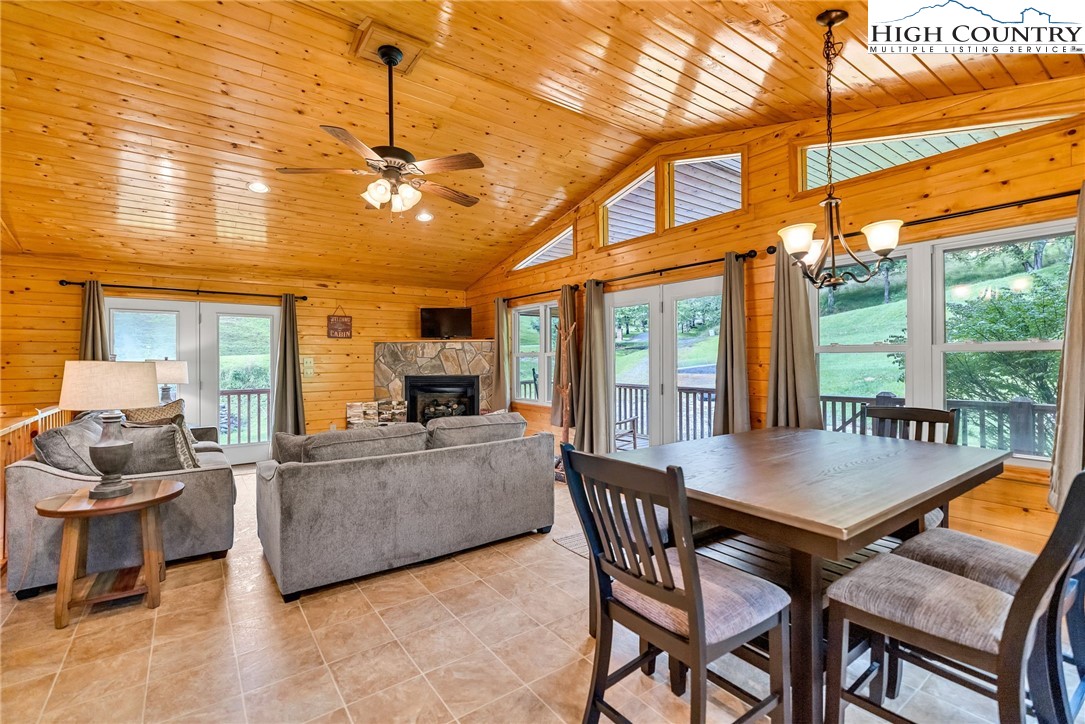 637 River Country Road Piney Creek, NC 28663 - Photo 10 of 49 a view of a dining room with furniture window and outside view
