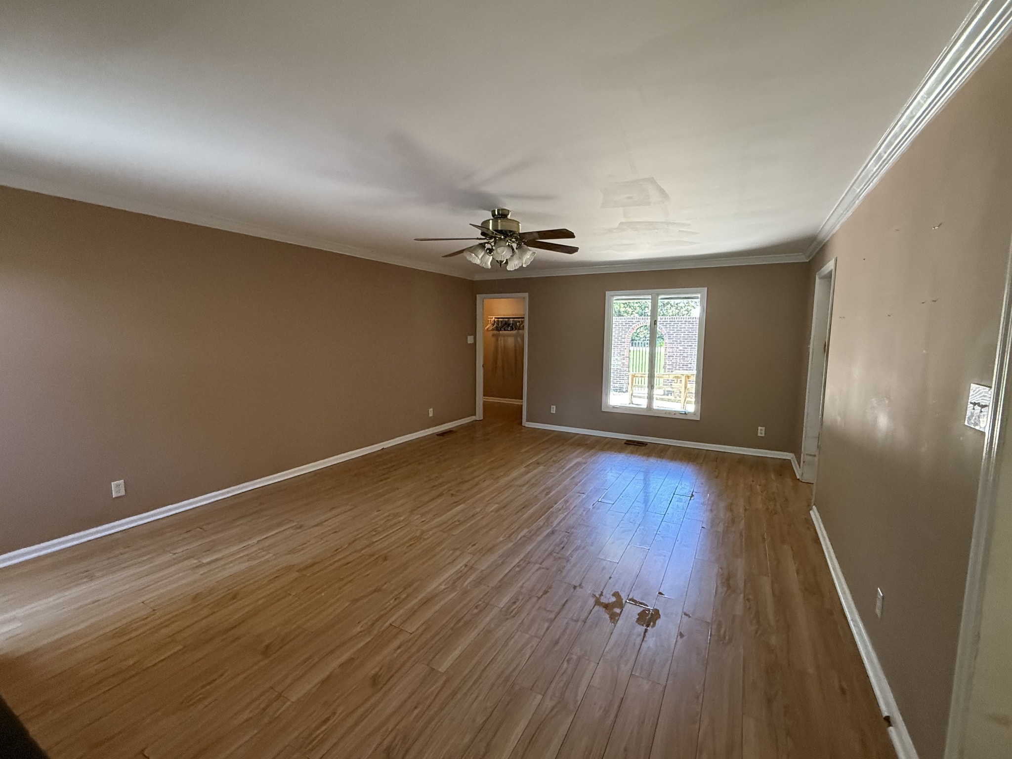 1419 Dripping Springs Road Winchester, TN 37398 - Photo 4 of 24 wooden floor in an empty room with a window
