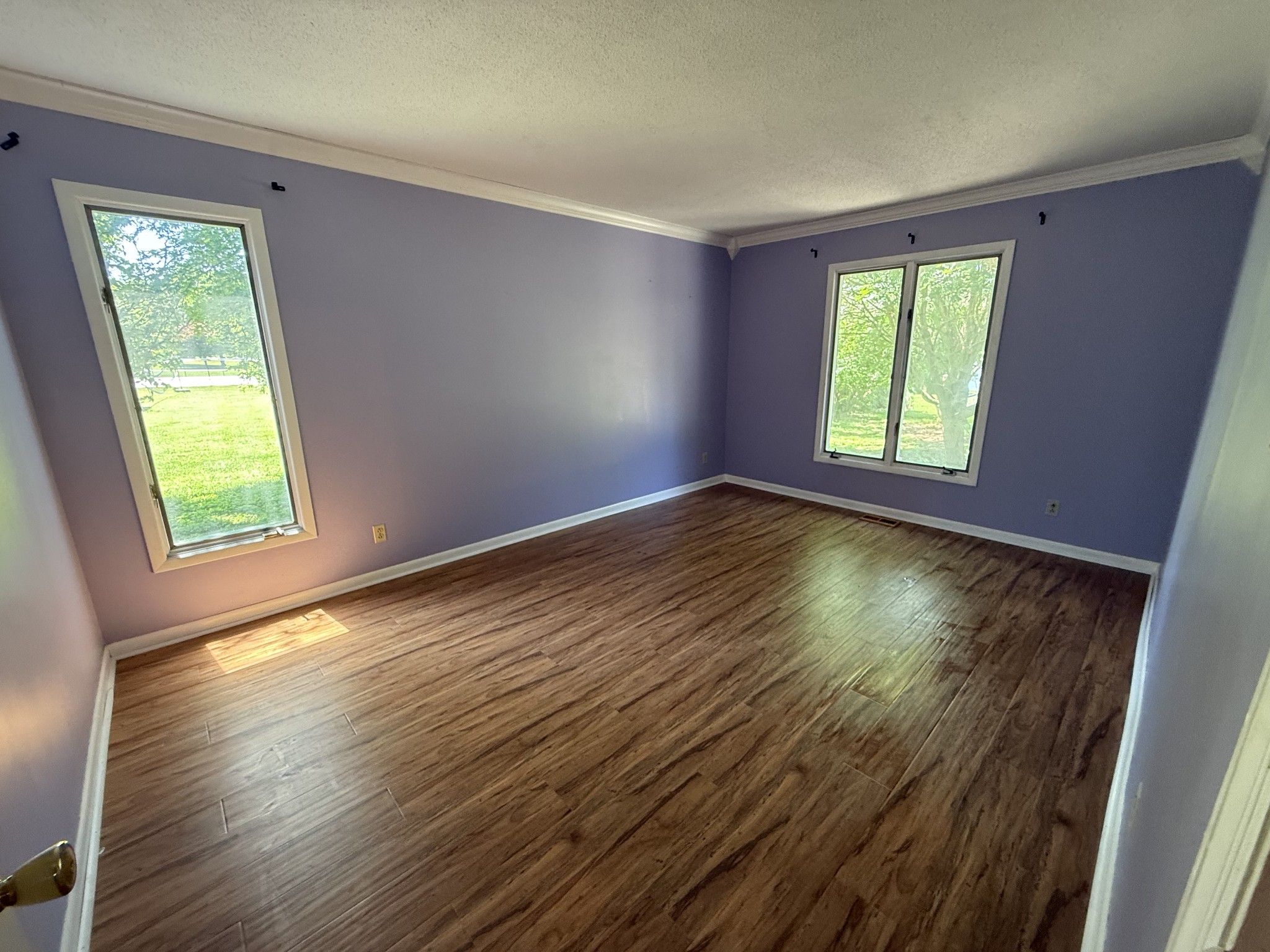 1419 Dripping Springs Road Winchester, TN 37398 - Photo 8 of 24 a view of an empty room with wooden floor and a window