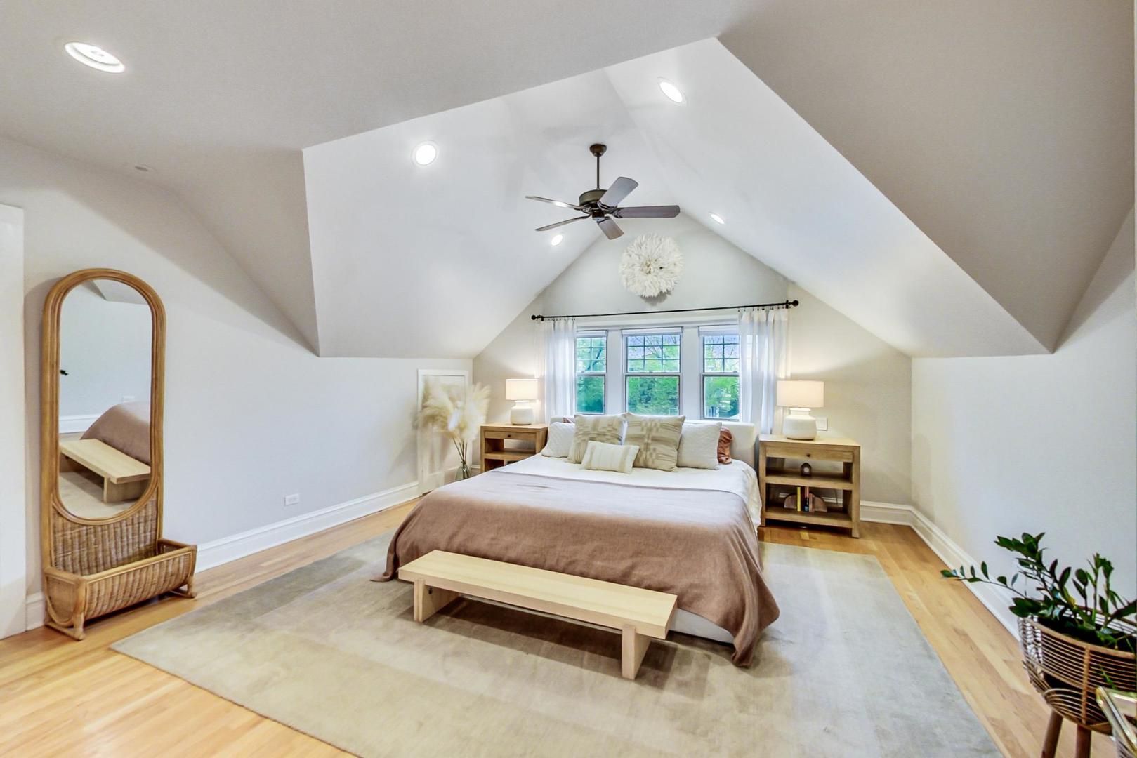 165 South Delaplaine Road Riverside, IL 60546 - Photo 24 of 51 a bedroom with a bed and a chandelier