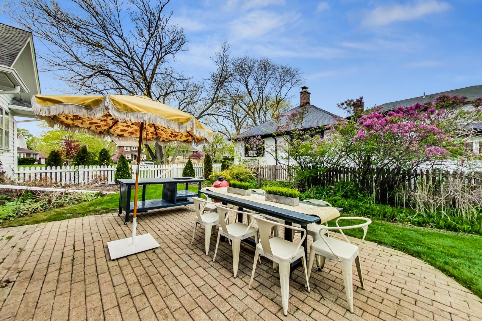 165 South Delaplaine Road Riverside, IL 60546 - Photo 39 of 51 a view of a chairs and table in patio with a yard