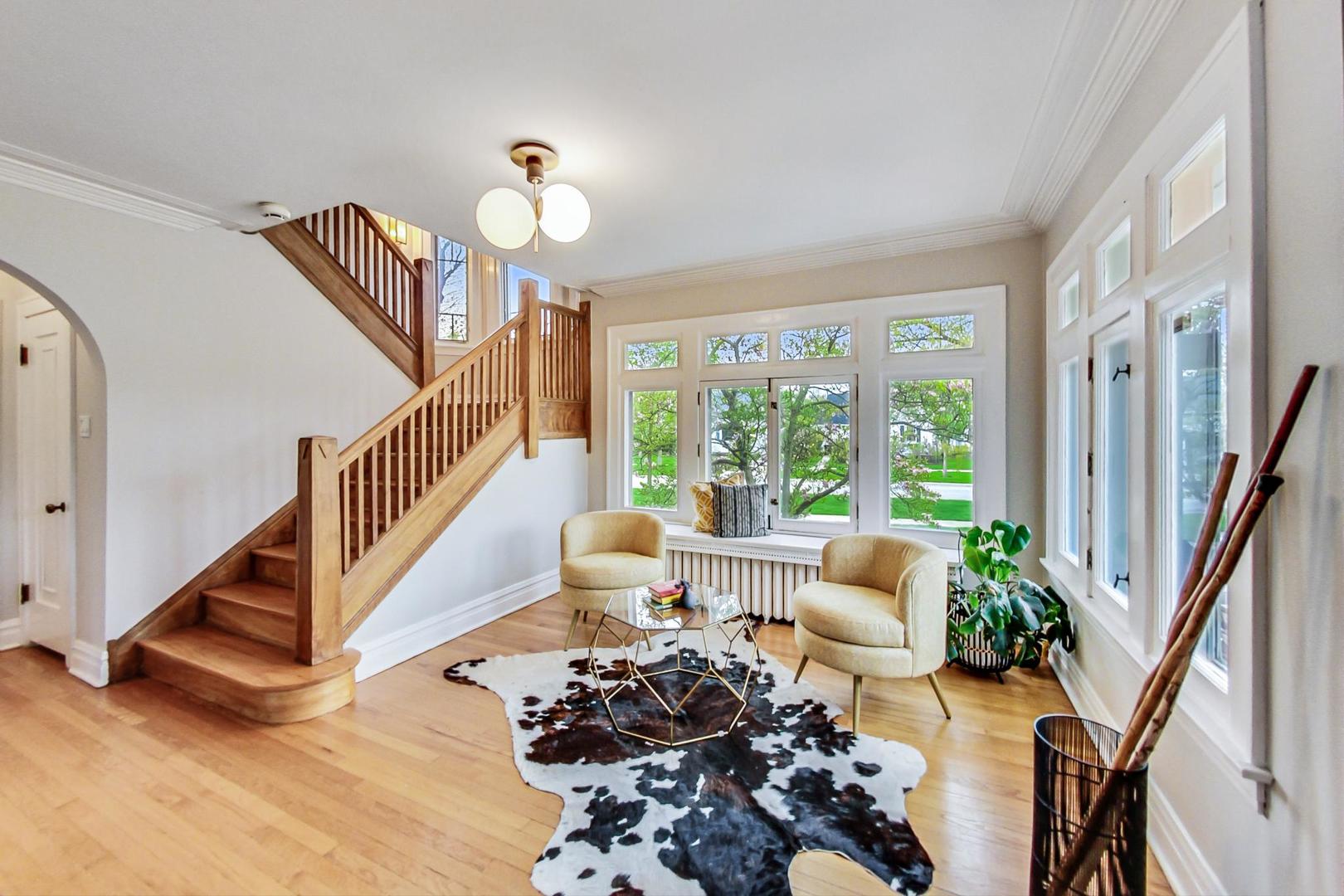 165 South Delaplaine Road Riverside, IL 60546 - Photo 7 of 51 a living room with furniture fireplace and a large window