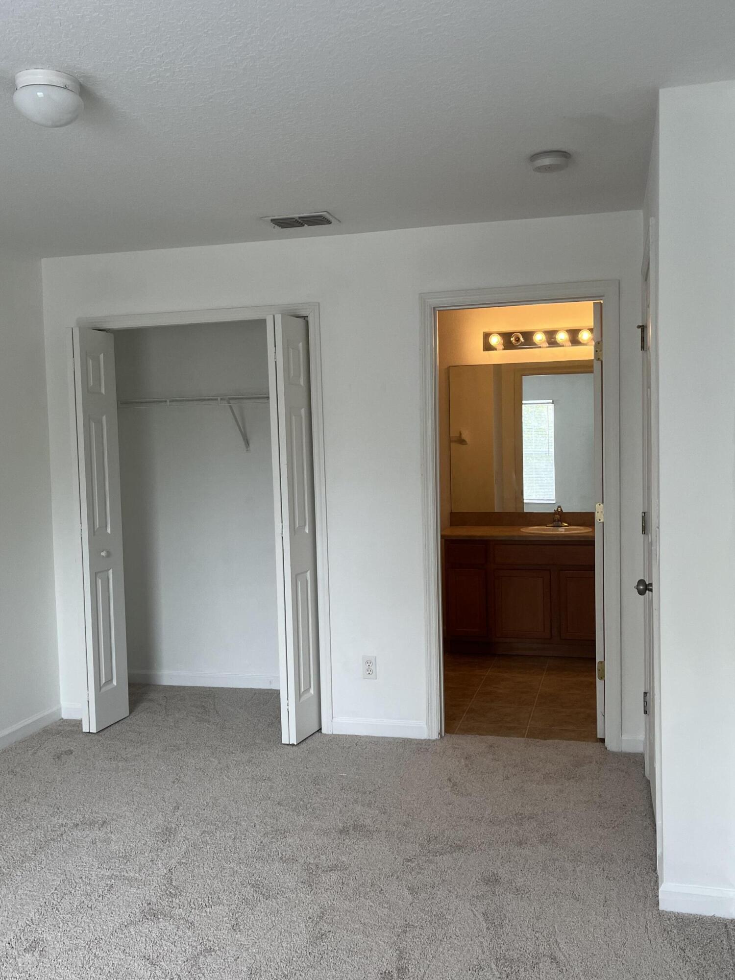 2785 Reston Street, Unit 102 Melbourne, FL 32935 - Photo 15 of 27 wooden floor and cabinet in a room