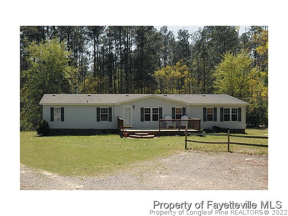 384 Tc Jones Road Raeford, NC 28376 - Photo 1 of 12 a aerial view of a house with swimming pool and sitting area