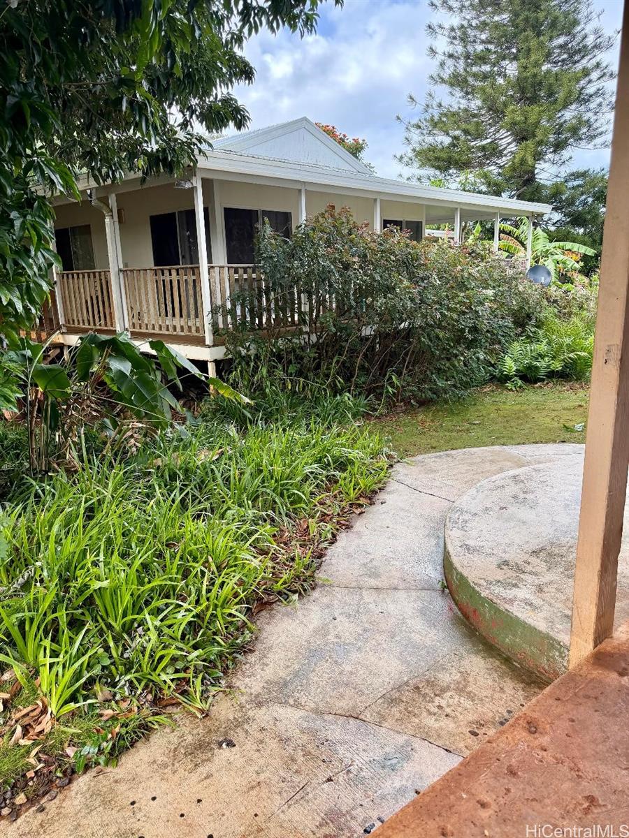 59-543 Alapio Road Haleiwa, HI 96712 - Photo 14 of 20 a front view of a house with garden