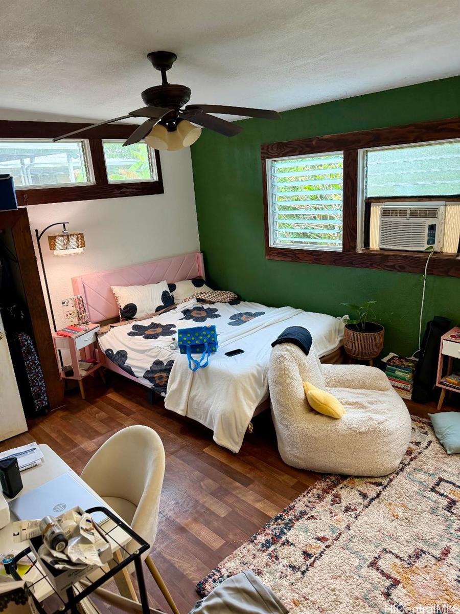 59-543 Alapio Road Haleiwa, HI 96712 - Photo 15 of 20 a bedroom with furniture and a window