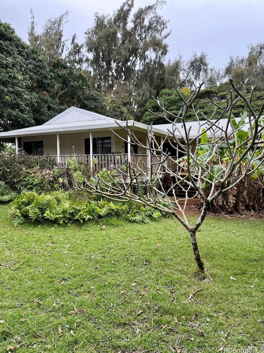 59-543 Alapio Road Haleiwa, HI 96712 - Photo 20 of 20 a view of a garden with a bench in the garden