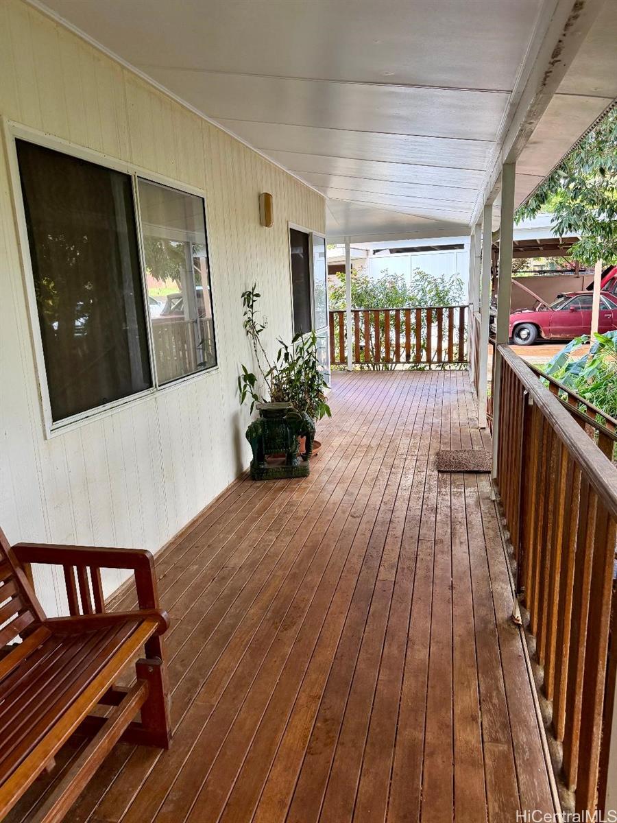 59-543 Alapio Road Haleiwa, HI 96712 - Photo 5 of 20 a view of a porch with furniture and garden view