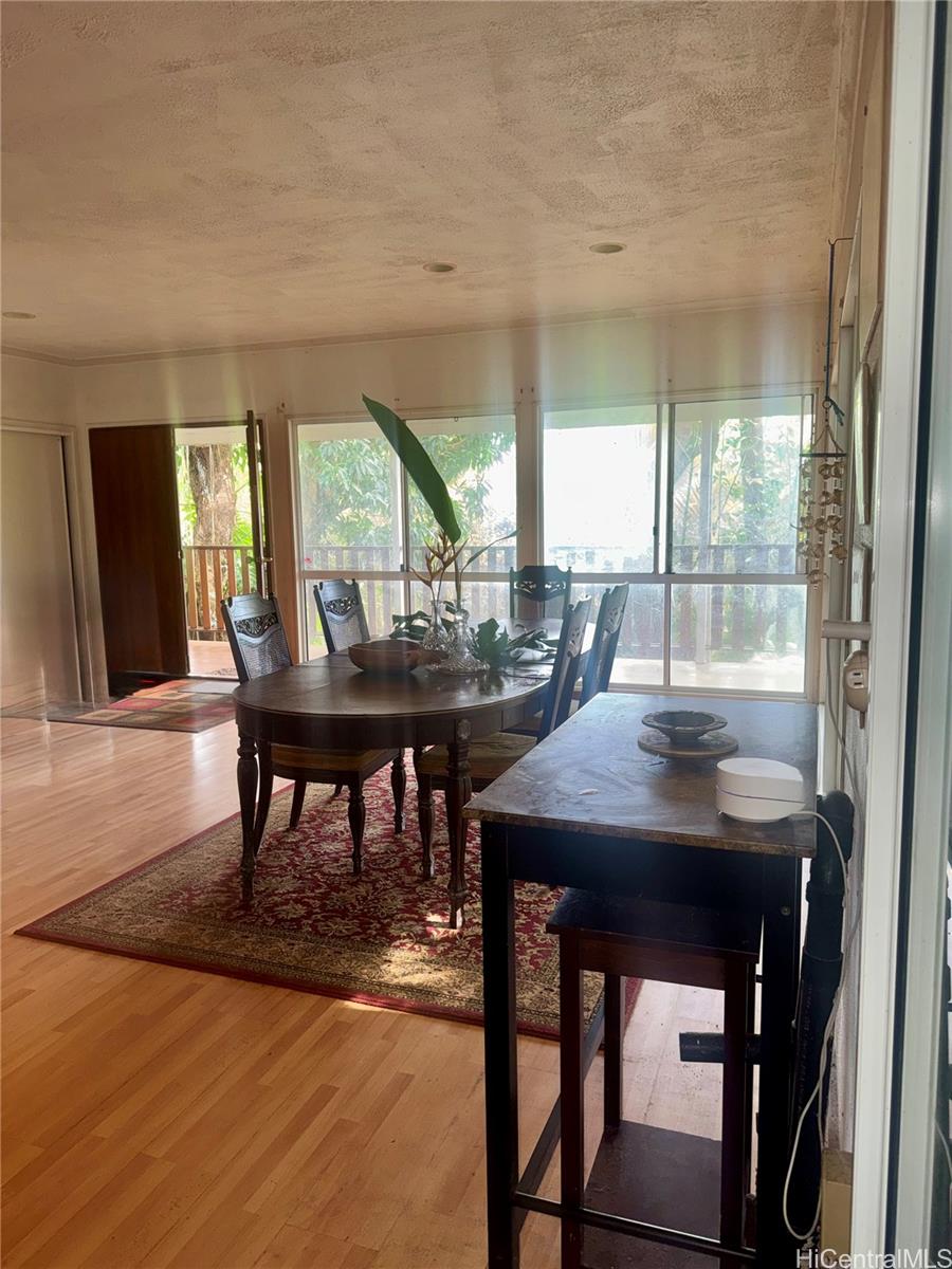 59-543 Alapio Road Haleiwa, HI 96712 - Photo 8 of 20 a view of a dining room with furniture and window