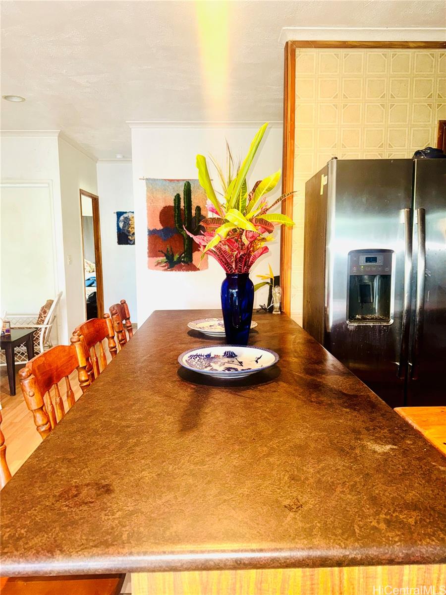59-543 Alapio Road Haleiwa, HI 96712 - Photo 10 of 20 a view of a living room with a table and chairs