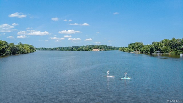 11673 Riverboat Drive Chester, VA 23836 - Photo 18 of 23 a view of a lake and a mountain in the background