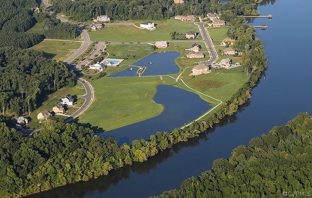11673 Riverboat Drive Chester, VA 23836 - Photo 23 of 23 an aerial view of a house a yard and a lake view
