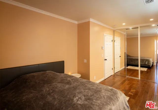 a bed room with a bed and a chandelier