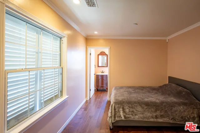 a bed room with a bed and a chandelier