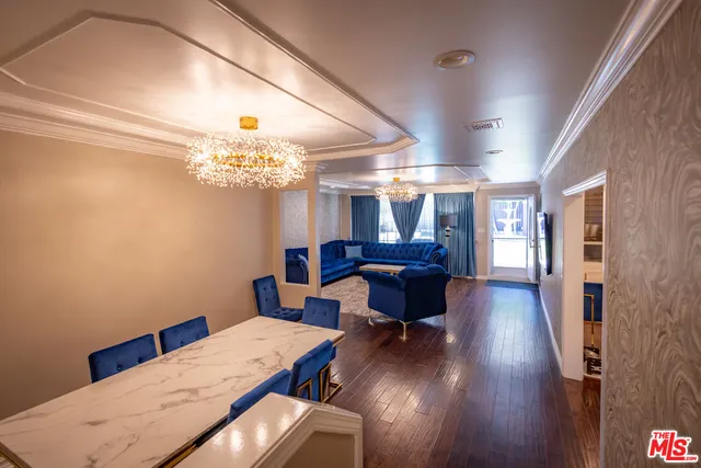 a view of staircase with wooden floor and white walls