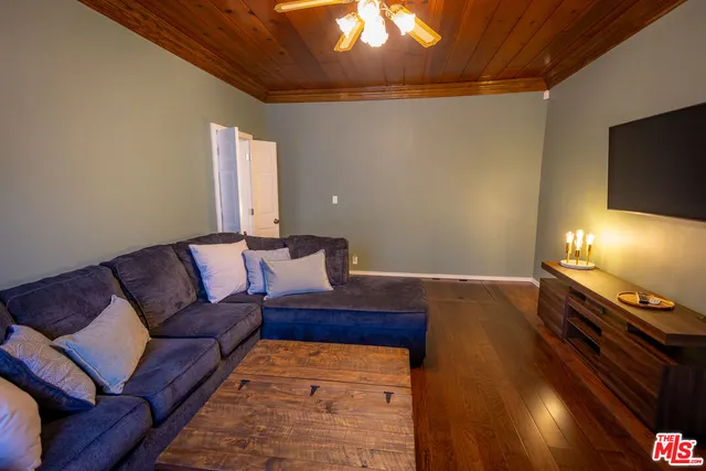 a bed room with a bed and a mirror