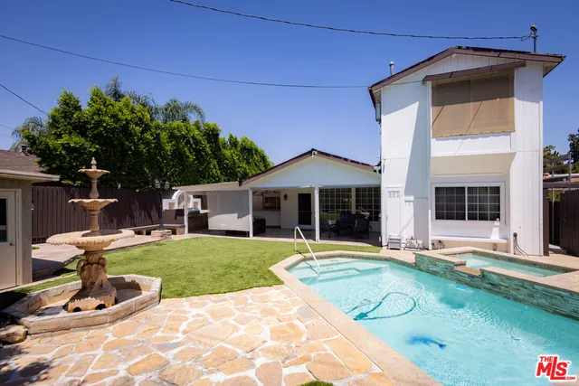 a view of a house with sitting area and furniture