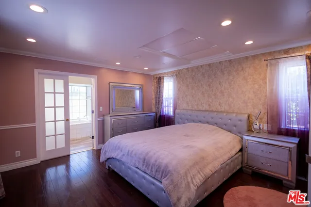 a bathroom with a toilet a sink a vanity and mirror