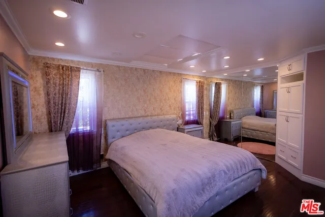 a kitchen with stainless steel appliances granite countertop a sink counter space and wooden floor