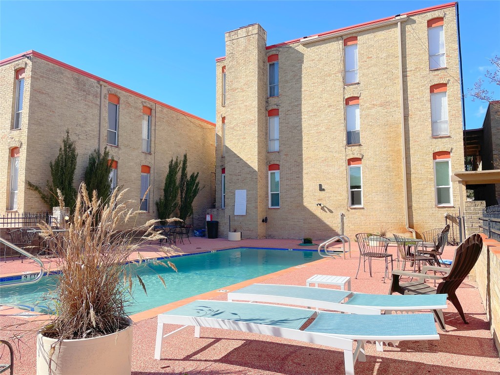 a lawn chairs sitting in front of a building