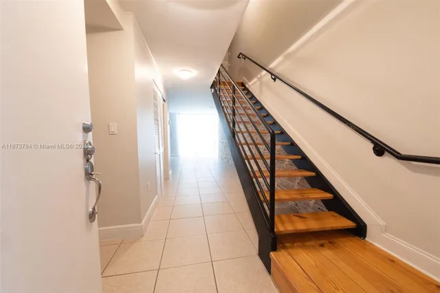 a view of entryway with wooden floor