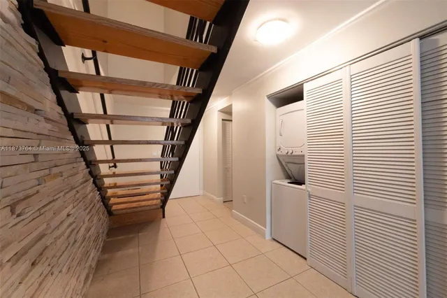 a view of entryway with stairs and wooden floor