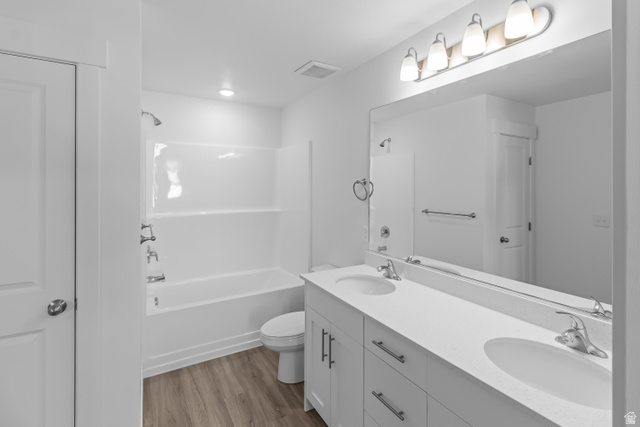 2995 South 265th Street West, Unit 752 Logan, UT 84321 - Photo 18 of 21 Bathroom featuring a double vanity with white cabinetry, integrated sinks, and chrome fixtures