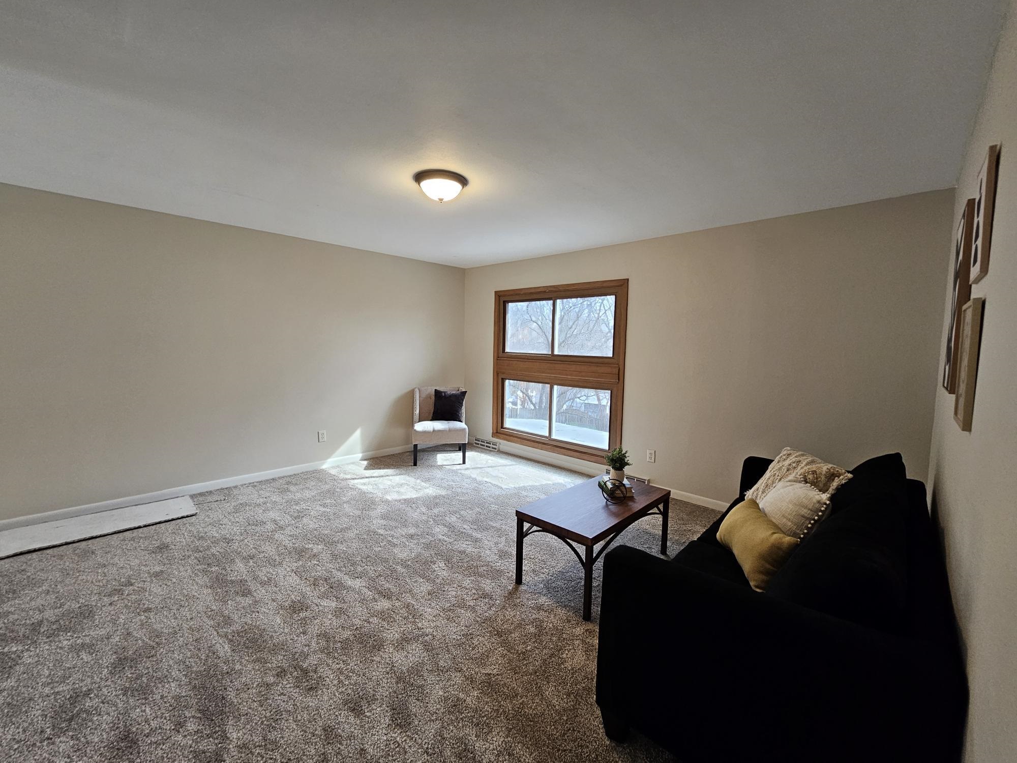 808 Crest View Trail Byron, IL 61010 - Photo 16 of 18 a living room with furniture and a window
