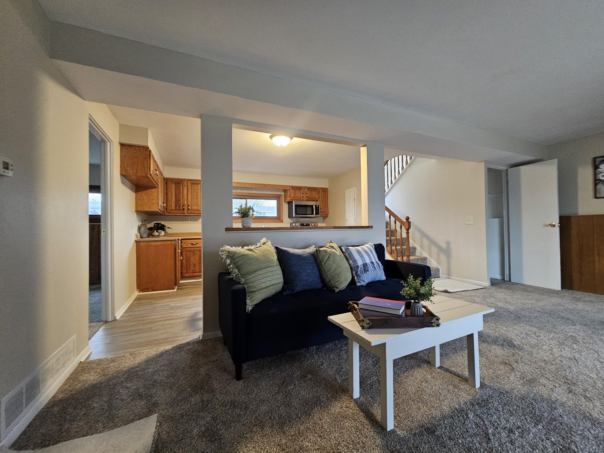 808 Crest View Trail Byron, IL 61010 - Photo 2 of 18 a living room with furniture and a wooden floor