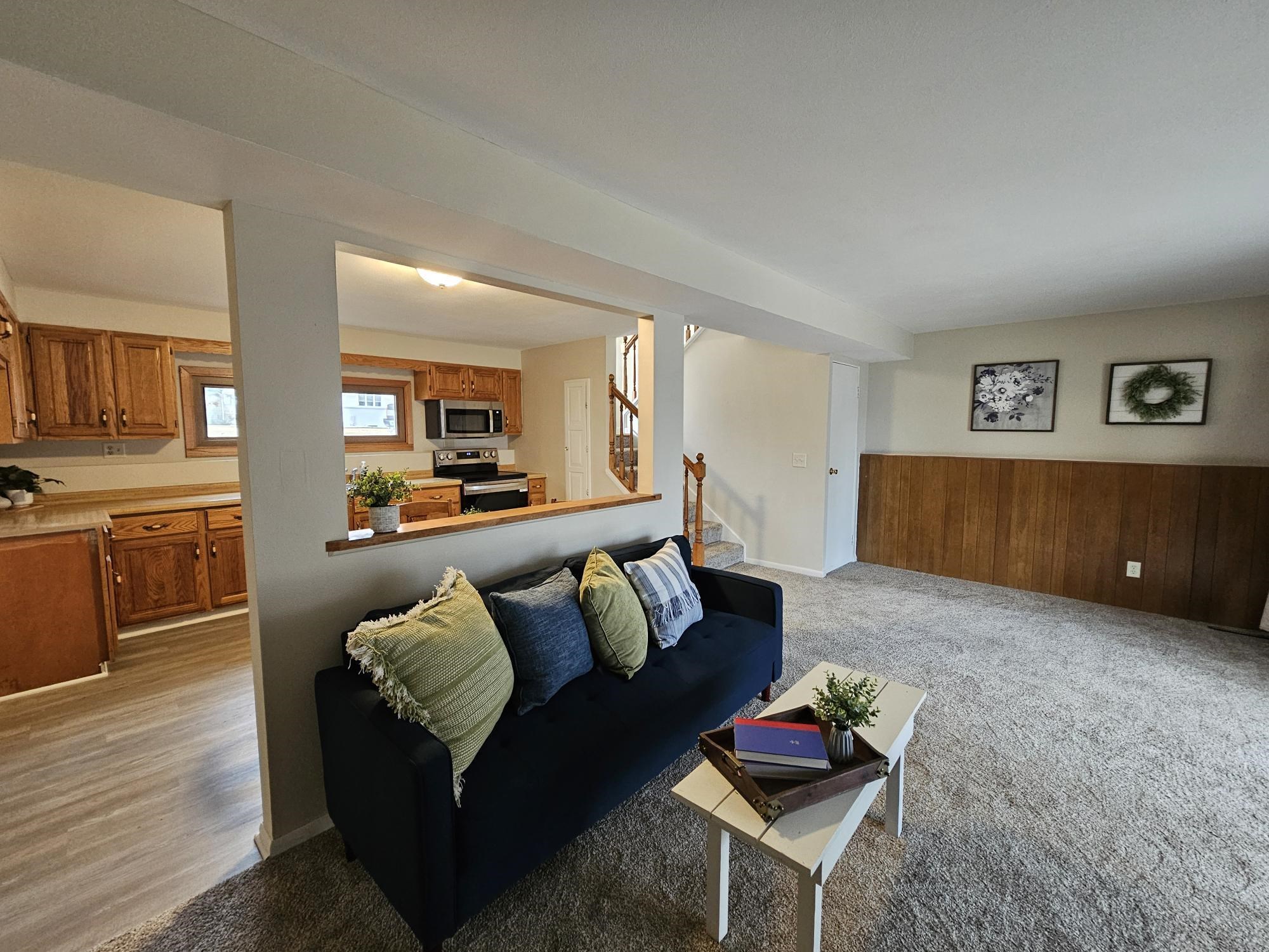 808 Crest View Trail Byron, IL 61010 - Photo 3 of 18 a living room with furniture and a kitchen view