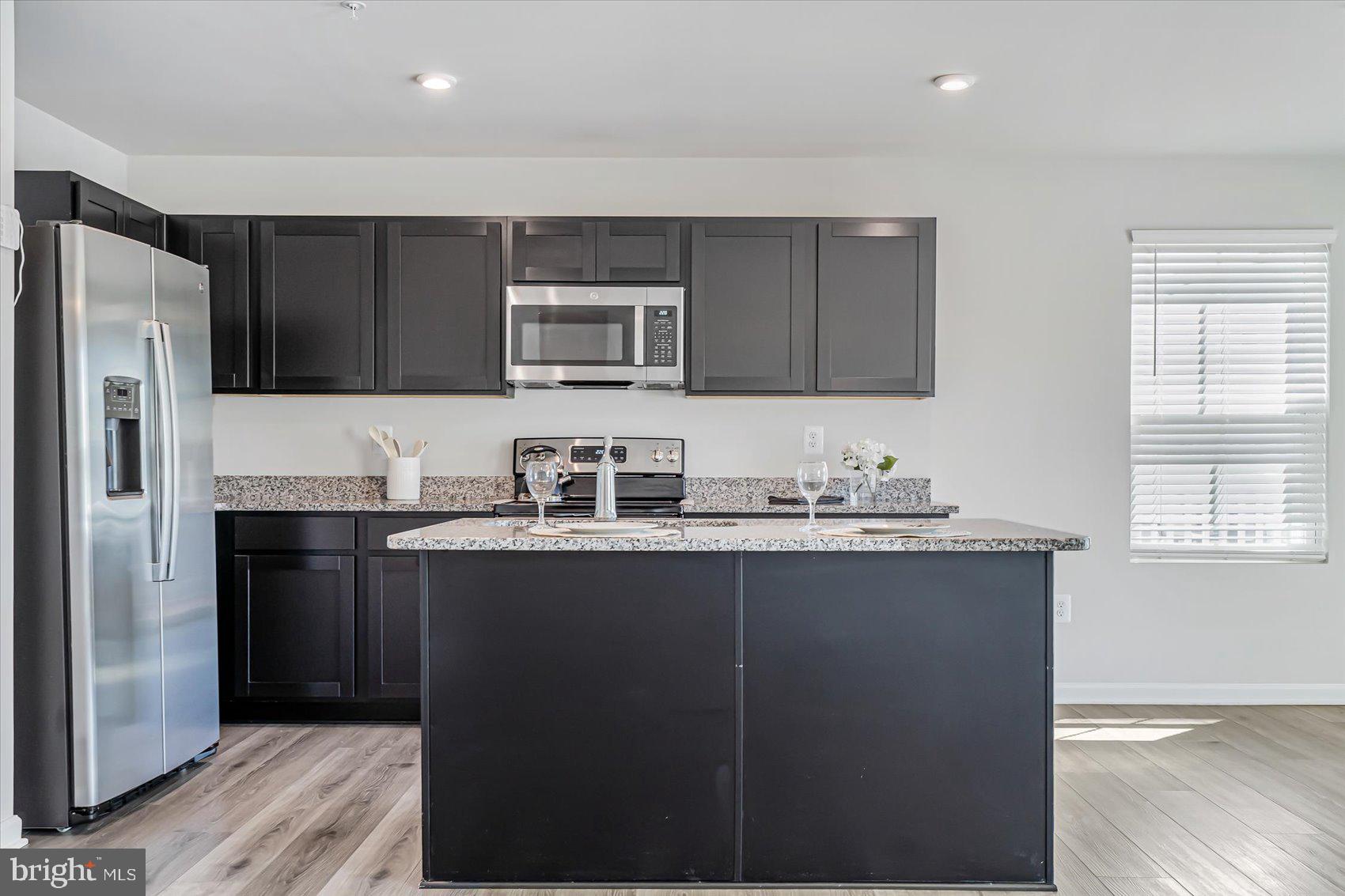 43 Olive Way Elkton, MD 21921 - Photo 13 of 44 a kitchen with stainless steel appliances granite countertop a refrigerator and a sink