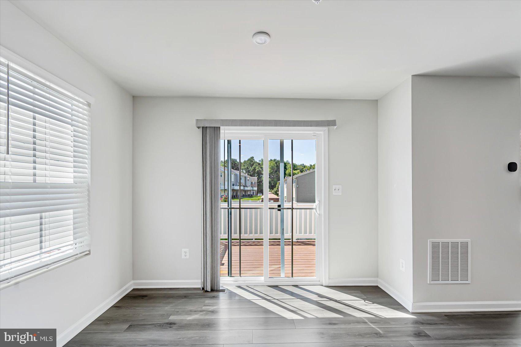 43 Olive Way Elkton, MD 21921 - Photo 17 of 44 a view of an empty room with wooden floor and a window