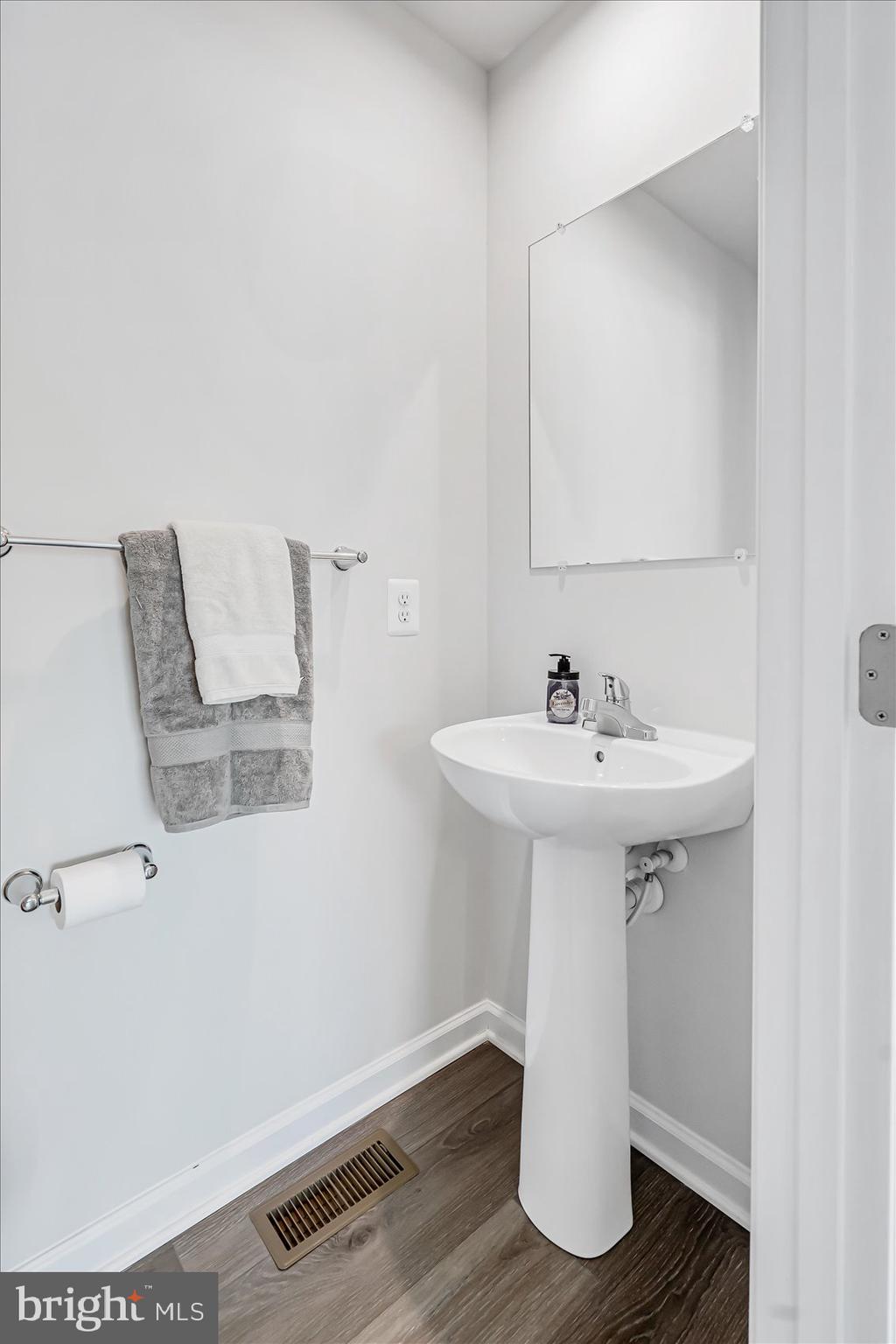 43 Olive Way Elkton, MD 21921 - Photo 18 of 44 a bathroom with a sink and mirror