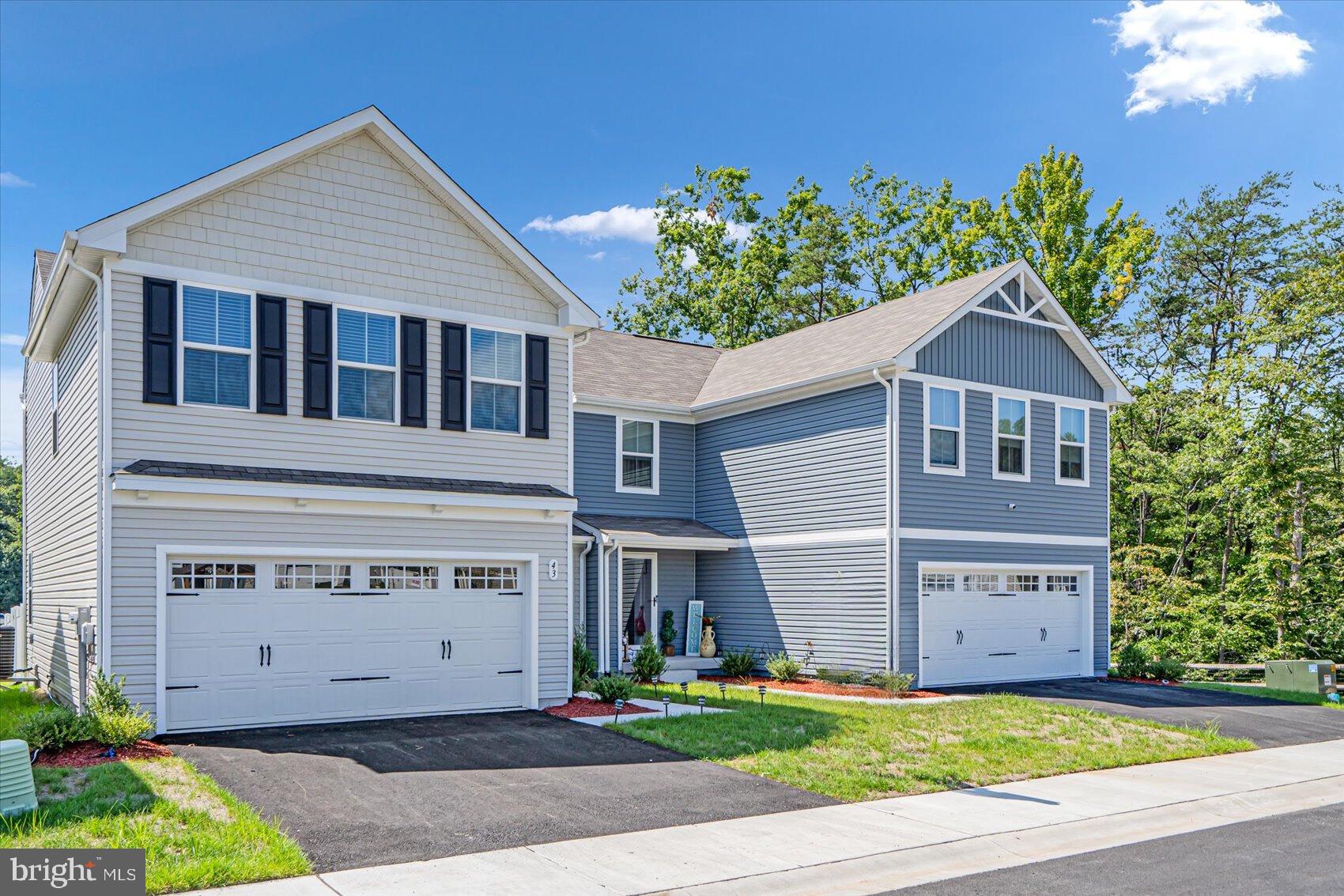 43 Olive Way Elkton, MD 21921 - Photo 2 of 44 a front view of a house with a yard and garage
