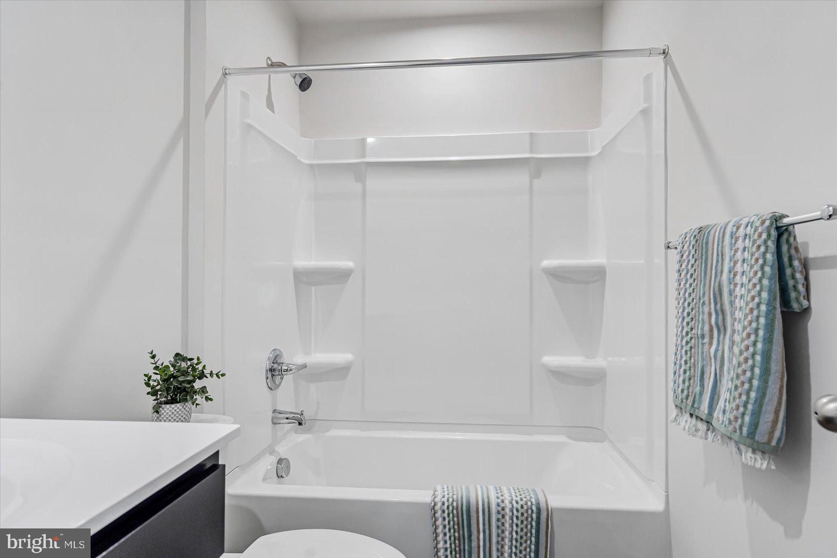 43 Olive Way Elkton, MD 21921 - Photo 30 of 44 a bathroom with a shower curtain and a bathtub