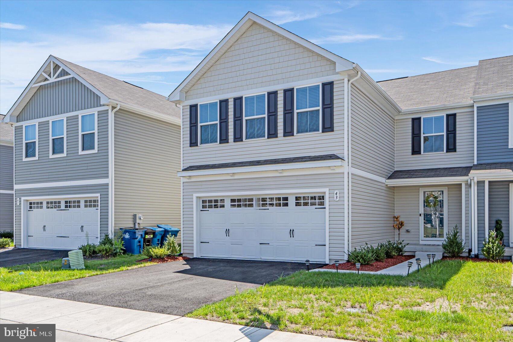 43 Olive Way Elkton, MD 21921 - Photo 3 of 44 a front view of a house with a yard and garage