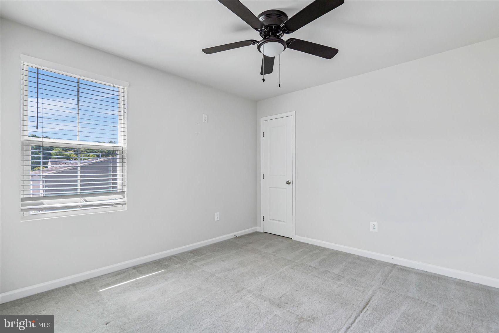 43 Olive Way Elkton, MD 21921 - Photo 35 of 44 an empty room with a window and a fan