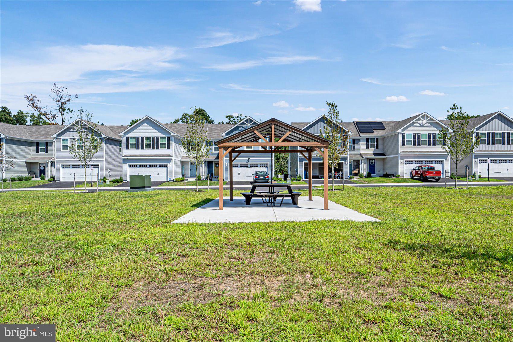43 Olive Way Elkton, MD 21921 - Photo 40 of 44 a front view of a house with swimming pool and green space
