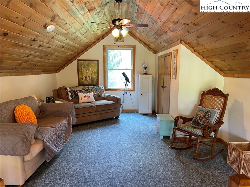 219 Lucky Alice Road Grassy Creek, NC 28631 - Photo 20 of 40 a bedroom with furniture and a ceiling fan