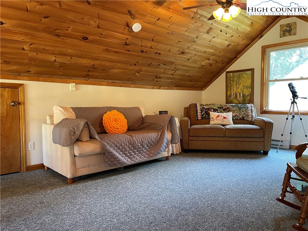 219 Lucky Alice Road Grassy Creek, NC 28631 - Photo 22 of 40 a living room with furniture and a window