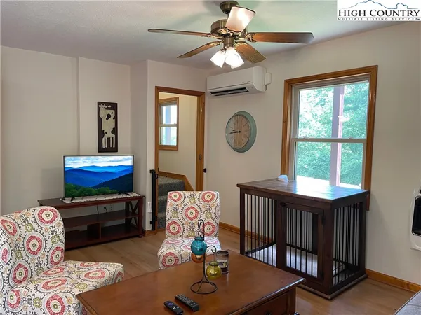 a bedroom with furniture and a window