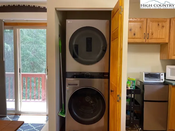 a view of a kitchen with washer and dryer