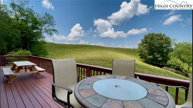 a view of a swimming pool with seating area
