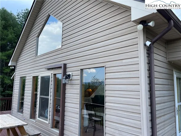 a view of a house with backyard and shower
