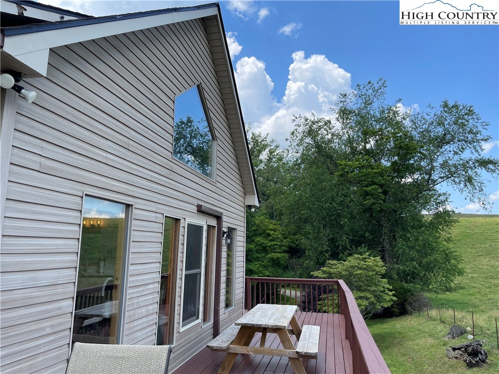 219 Lucky Alice Road Grassy Creek, NC 28631 - Photo 36 of 40 a view of backyard with swimming pool and outdoor seating