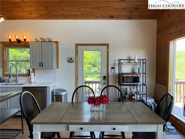 a kitchen with a table chairs and a stove