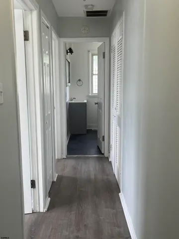 a view of a hallway with a room