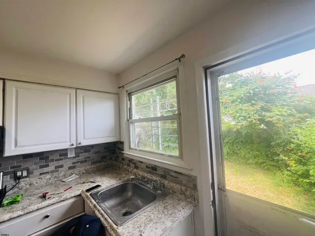 a kitchen with a sink and a window